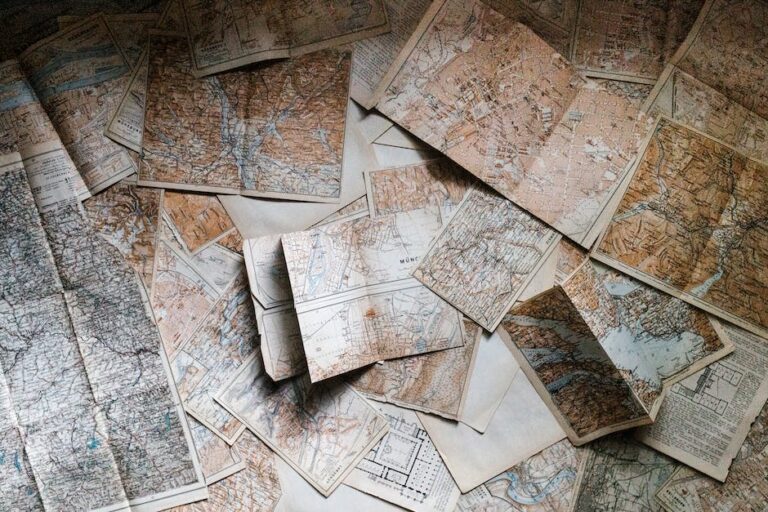 A pile of old maps on the floor.